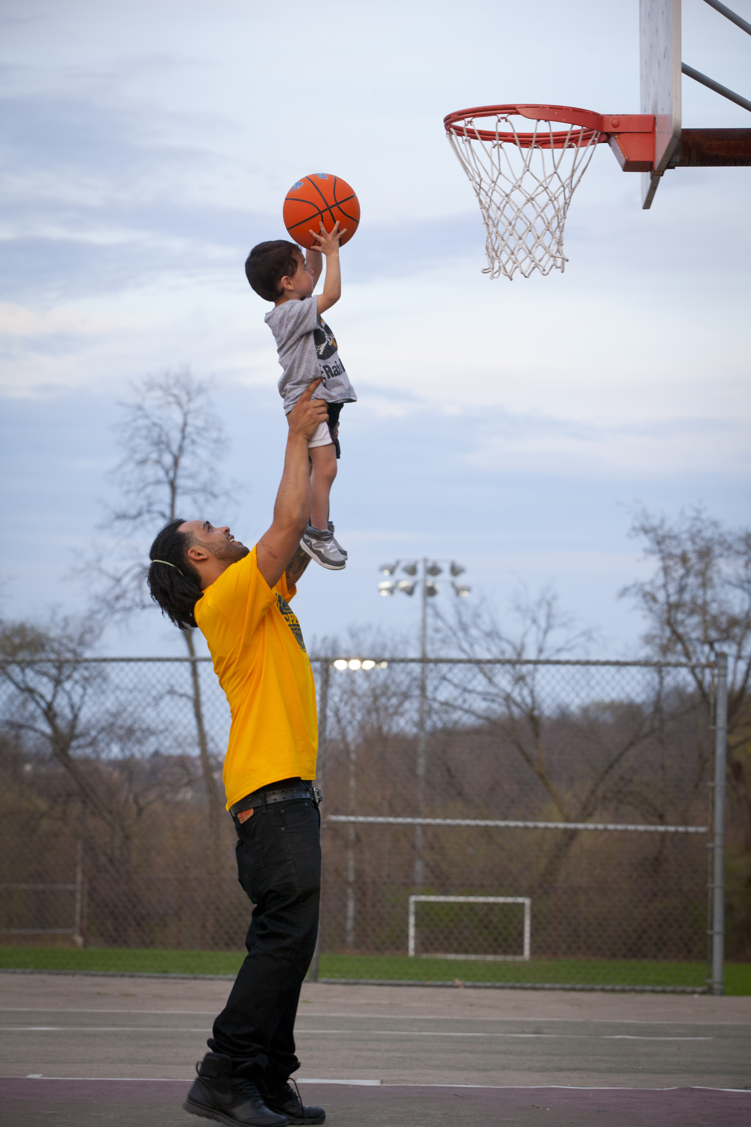 Man and son play basketball, Brookline, Pittsburgh.