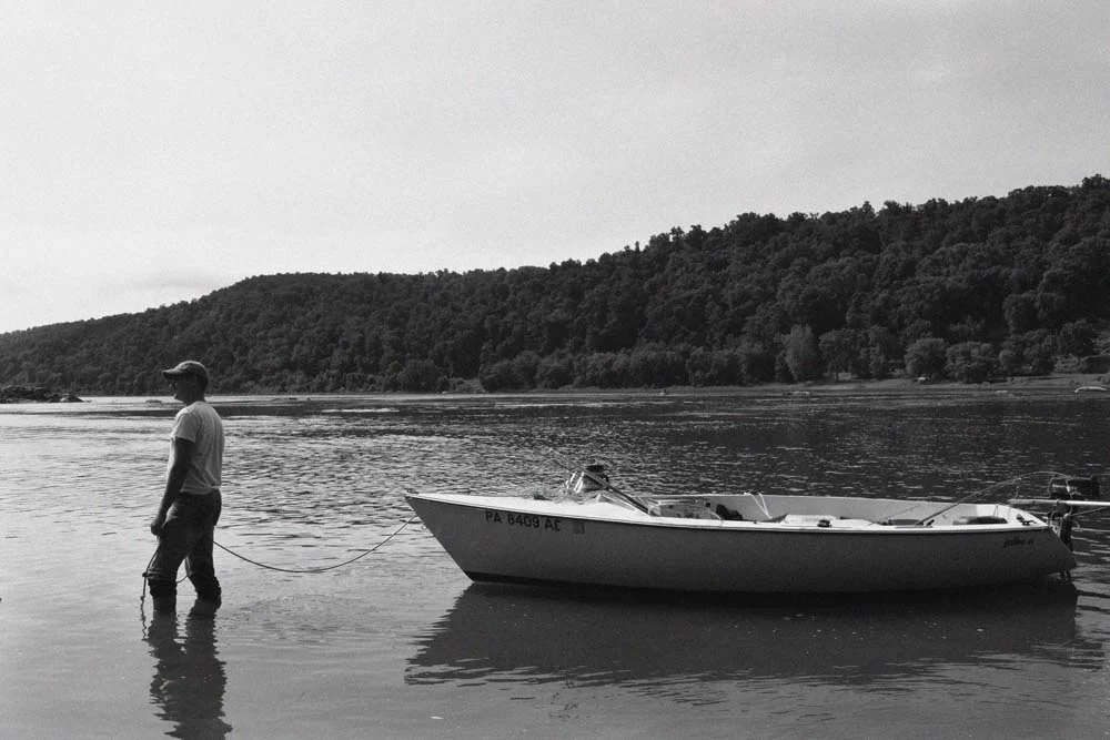 Man with boat, Schuylkill River.