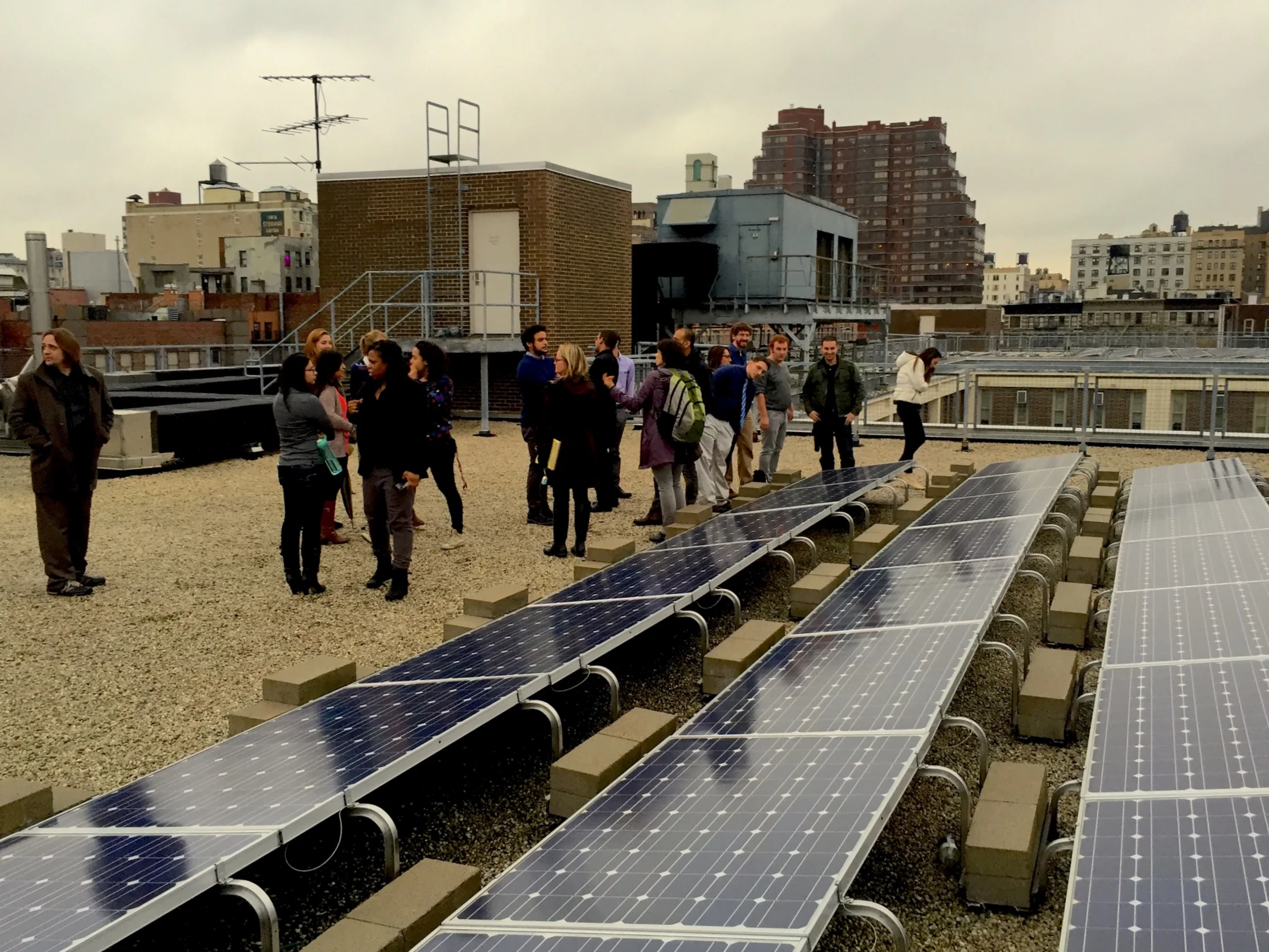 UAGC Staff with Solar One on the rooftop of the Brandeis Campus