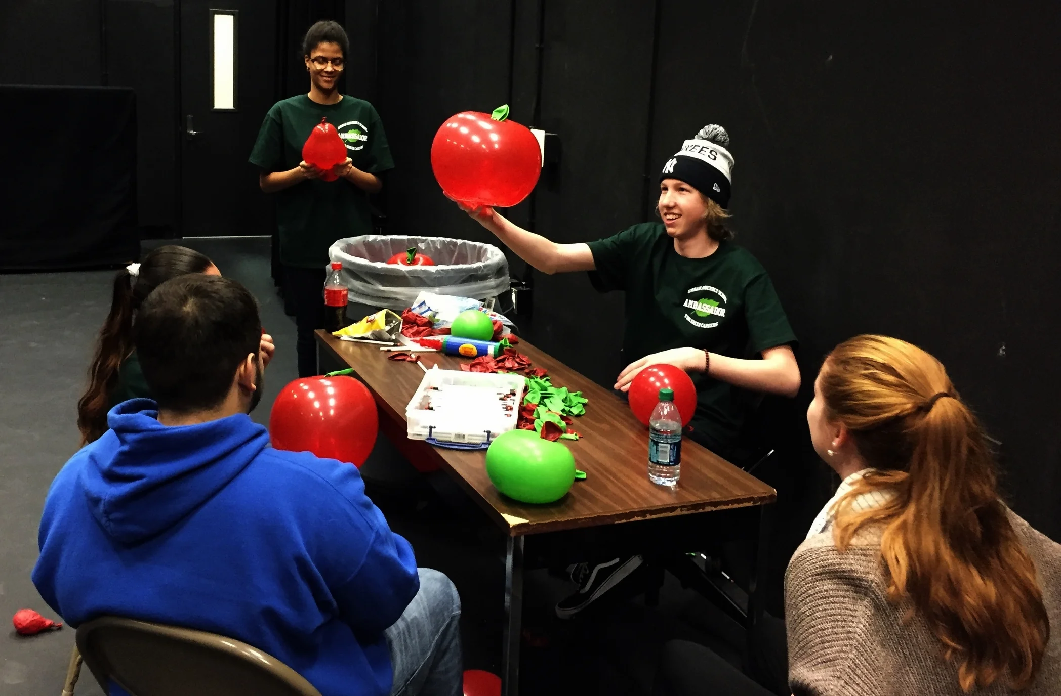 UAGC Ambassadors making balloon apples for expo participants with Barnes & Noble materials