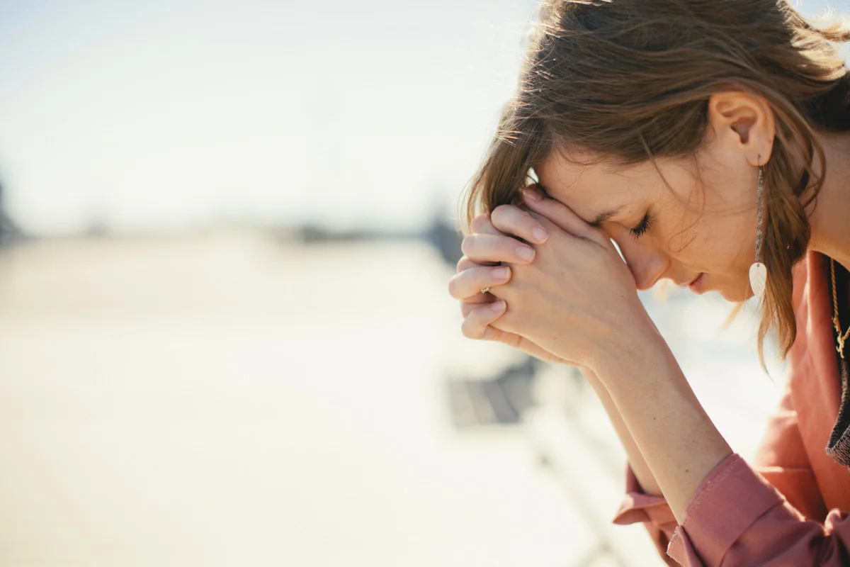 woman praying in the sun.jpg