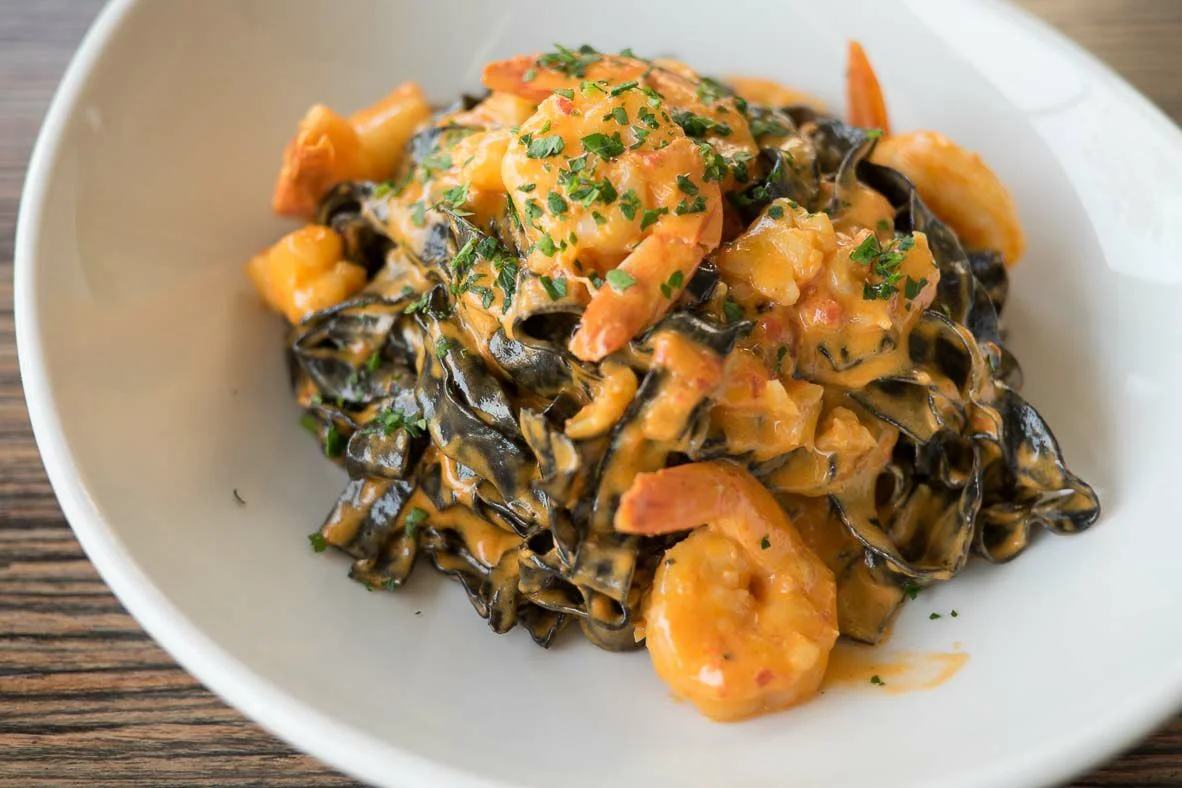 Squid ink spaghetti with lobster bisque sauce