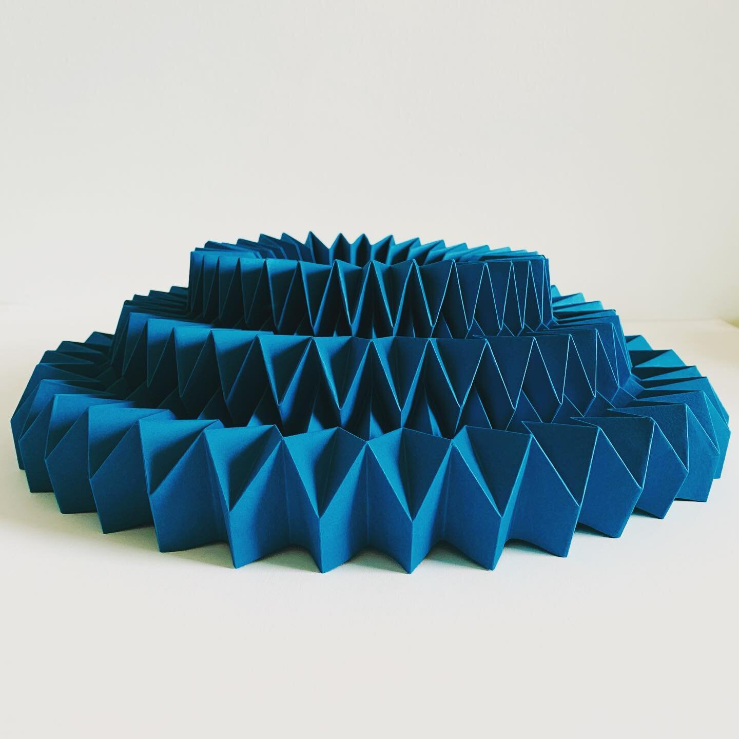 Folded tiers in blue 
.
.
.
.
#fold #folded #paper #papercraft #papercrafts #origami #origamicraft #colour #workingwithcolour #handmade #madebyhand #craft #design #3Dcraft #geometry #geometric #papercrafts