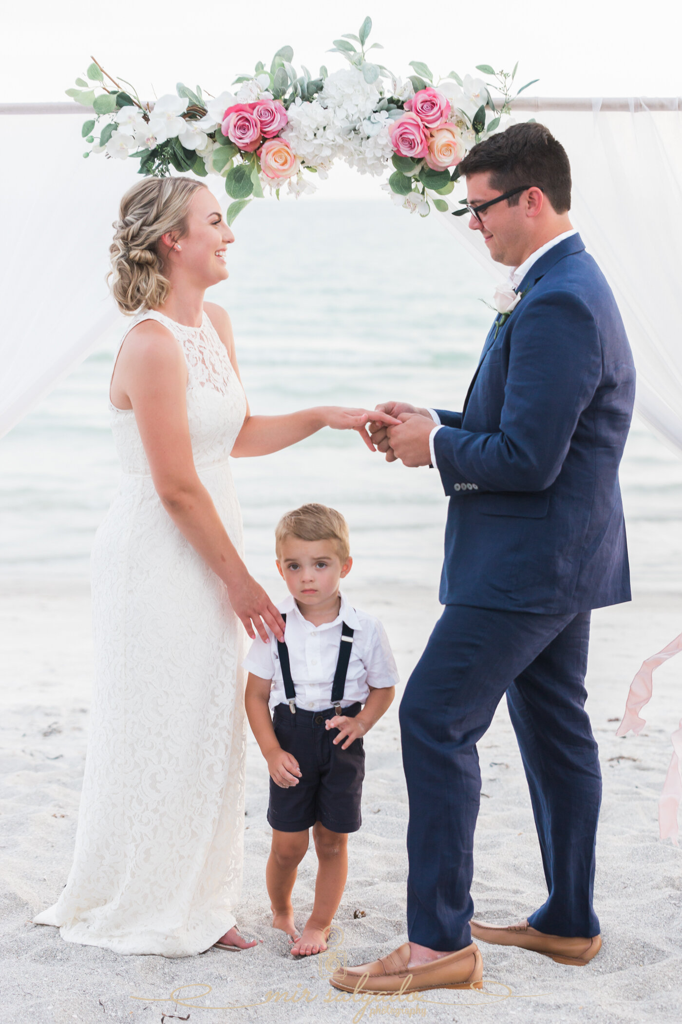 wedding-vows, beach-wedding-ceremony, resort-venue, bride-wedding-dress, groom-outfit