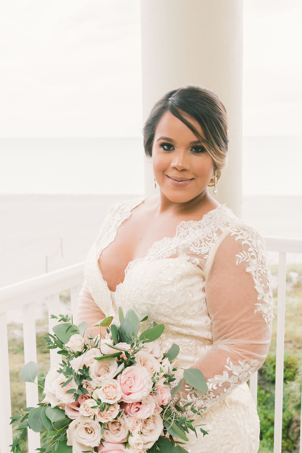 v-neck-wedding-dress, v-neck-lace-wedding-dress, long-sleeved-lace-wedding-dress, pink-and-white-flower-bouquet, front-of-wedding-dress