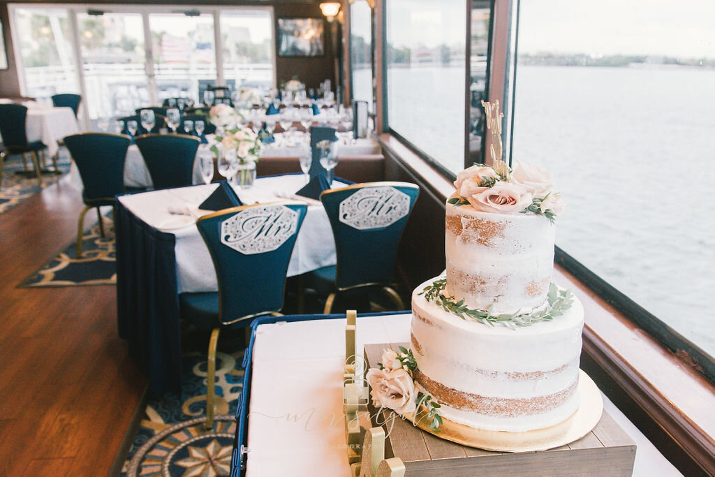 mr-and-mrs-wedding-table, mr-and-mrs-wedding-chairs, wedding-venue, wedding-reception-on-cruise, yacht-wedding, pink and navy-blue-wedding-colors