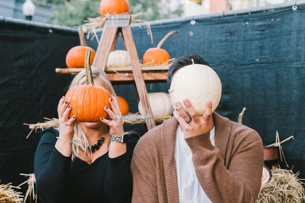 pumpkins-and-engagement-pictures, engagement-photo-props, pumpkin-as-fall-photo-props, pumpkin-patch-engagement-photos