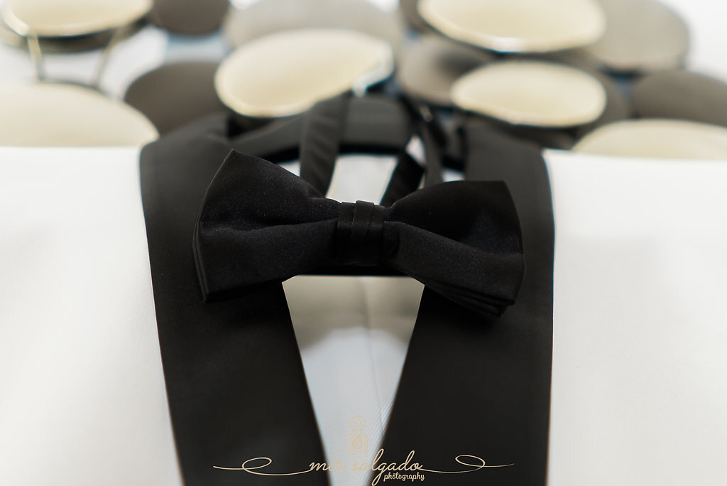 wedding-bow-tie, grooms-wedding-outfit, grooms-bow-tie, groom-suit-colors, black-and-white-suit