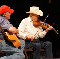 Jim Widner (right) competed in Weiser in the 1950s and 1960s. He brought down the house as a recent guest performer.