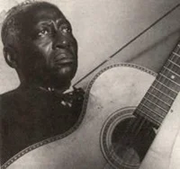 Huddie "Lead Belly" Ledbetter, c. 1930-1940, discovered by John Lomax