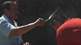 Vietnam War veteran Marvin Weatherwax presents an eagle feather to Martin Connelly, who served in both Iraq and Afghanistan.