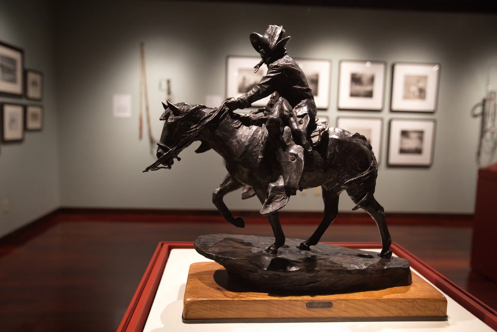 Horses in the American West , a Nevada Museum of Art-Western Folklife Center collaborative exhibition in the Wiegand Gallery. Safe and Sound by Harry Jackson (1982) bronze, collection of Bill Searle. Photo by Charlie Ekburg, 2017 National Cowboy Poetry Gathering.