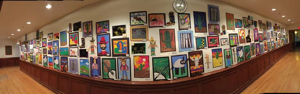 Panoramic photograph of Elko County grade school students' art exhibition in the G Three Bar theater, 2017 National Cowboy Poetry Gathering.