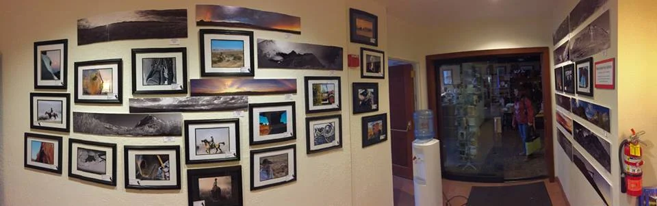 Panoramic photograph of Elko County High School student photography in the Western Folklife Center elevator lobby, 2017 National Cowboy Poetry Gathering.