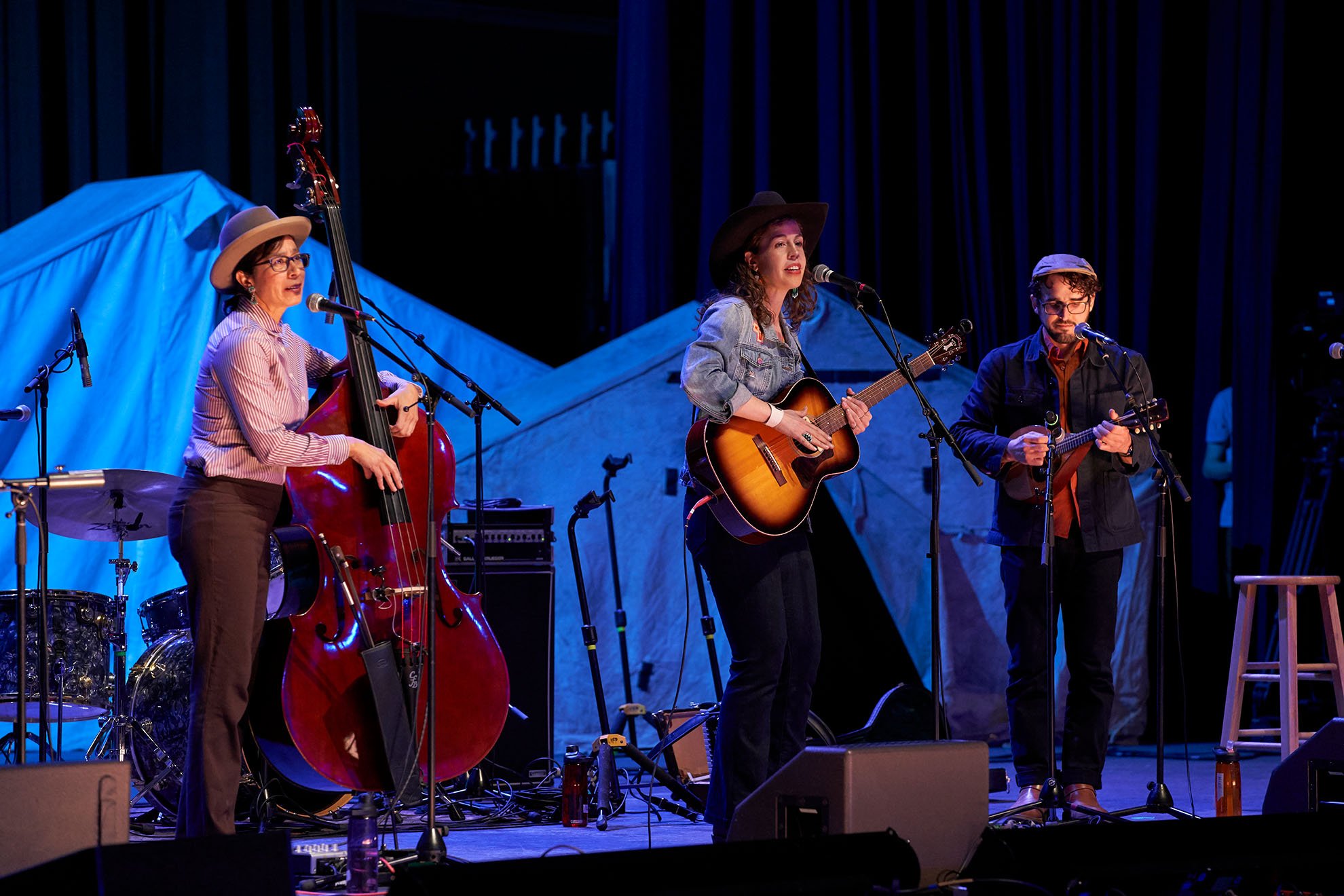  Lara Manzanares (center) performs with bandmembers Tanya Nuñez (left) and Jordan Wax (right) on the Elko Convention Center Auditorium stage. Photo by Marla Aufmuth. 