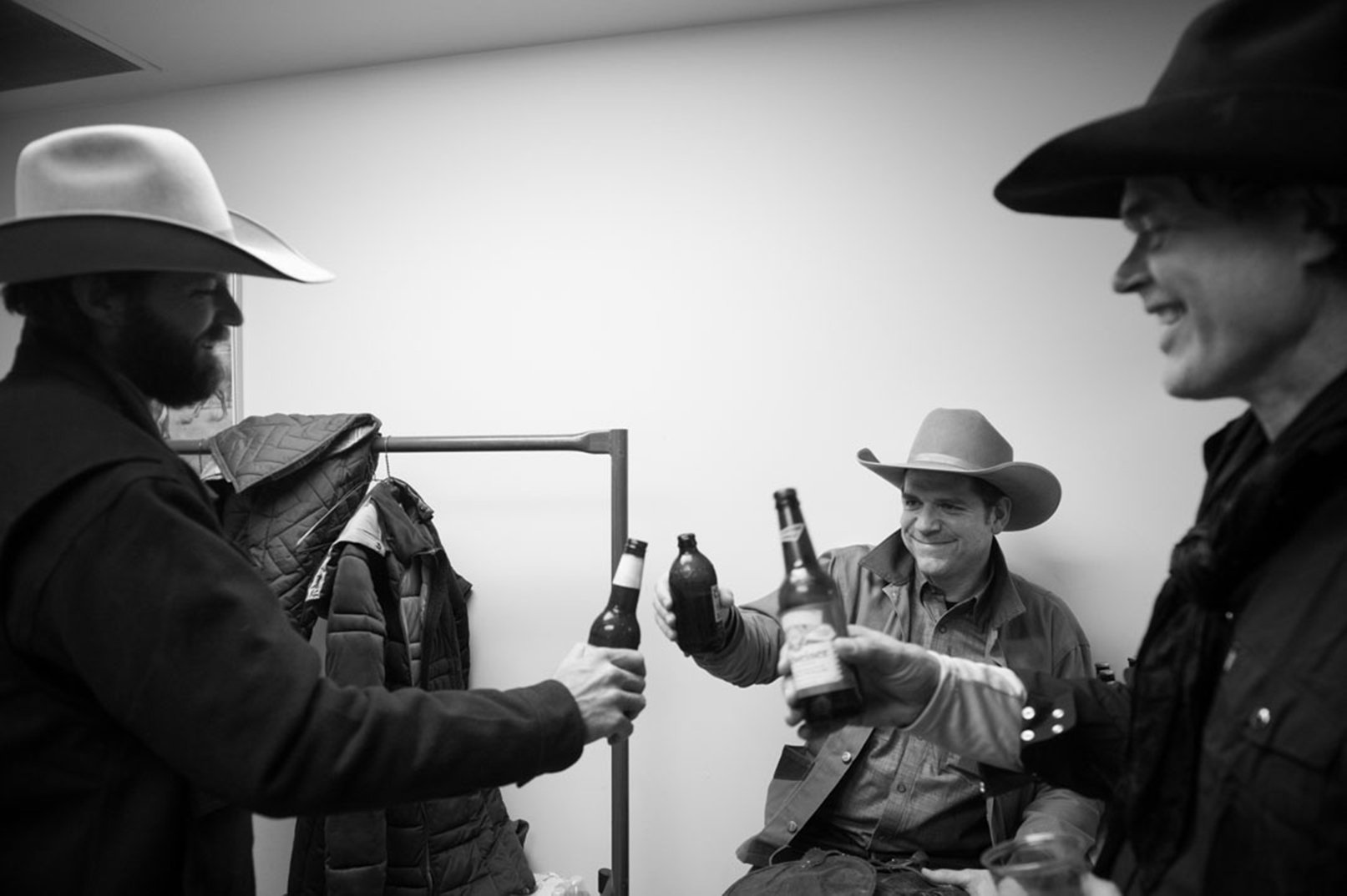  Jake Riley, Andy Hedges, and Corb Lund cheers backstage at the  All O’er the West  show. Photo by Jessica Brandi Lifland. 