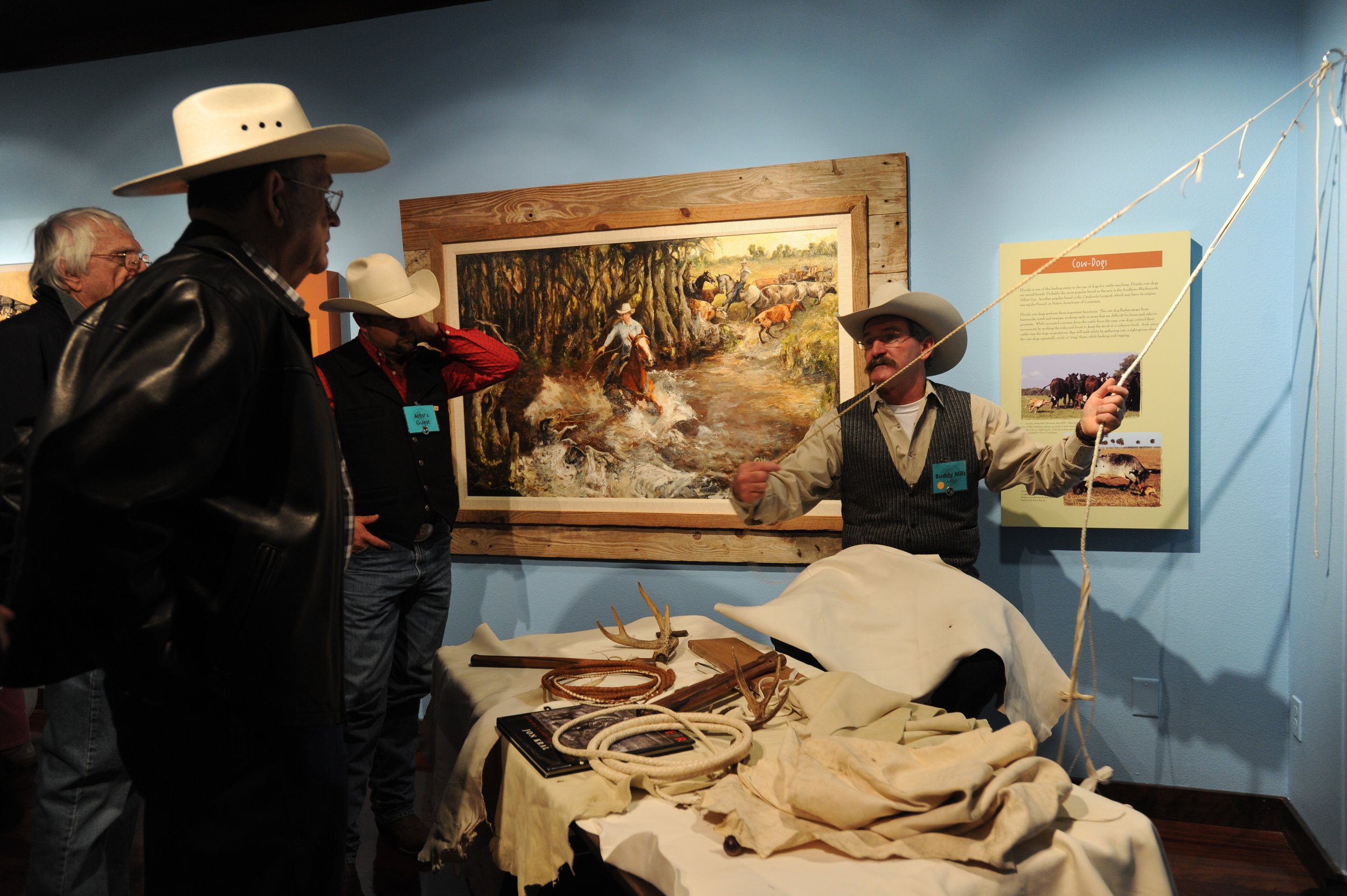 Buddy Mills demonstrates rawhide whip making at Wiegand Gallery's "Florida Cattle Ranching, Five Centuries of Tradition" exhibit at the 26th Gathering. Photo by Jessica Brandi Lifland.