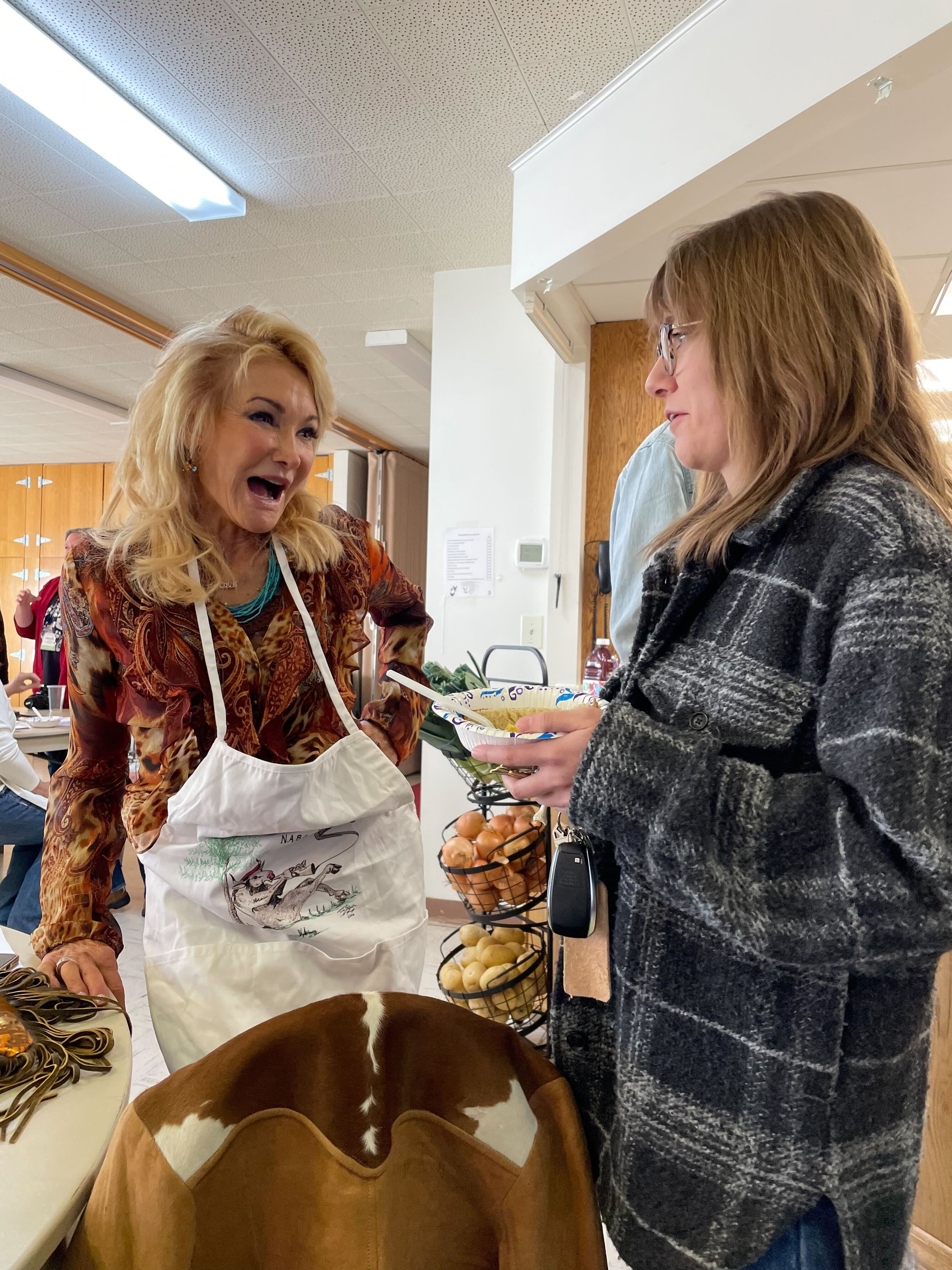 Callie with volunteer and local business owner Lina Blohm. Photo by Greg Greenhaw