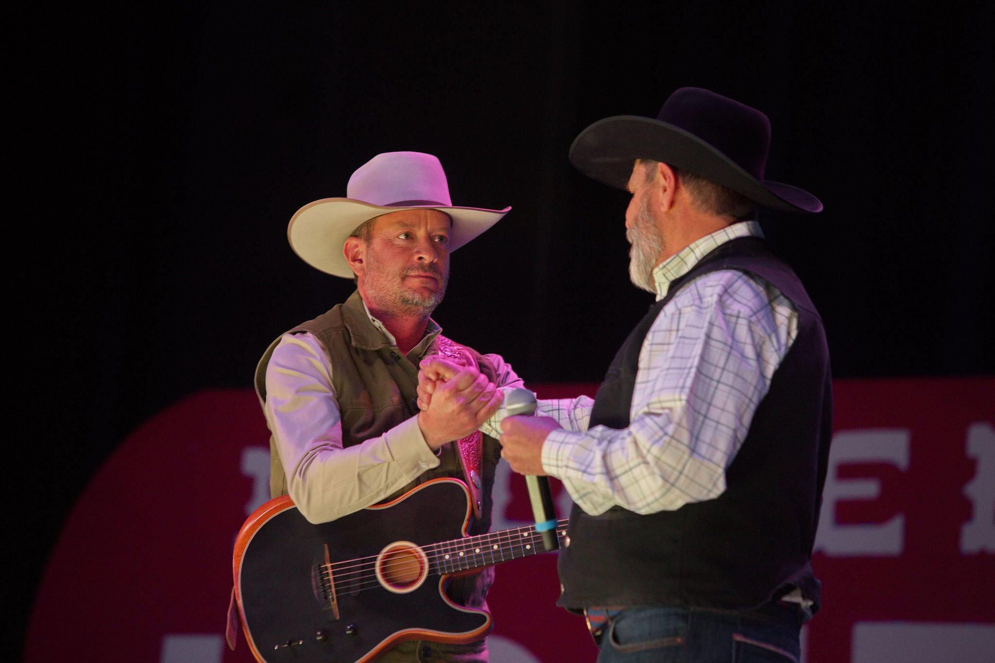 Brenn Hill and Andy Nelson share a moment on stage. Photo by Charlie Ekburg