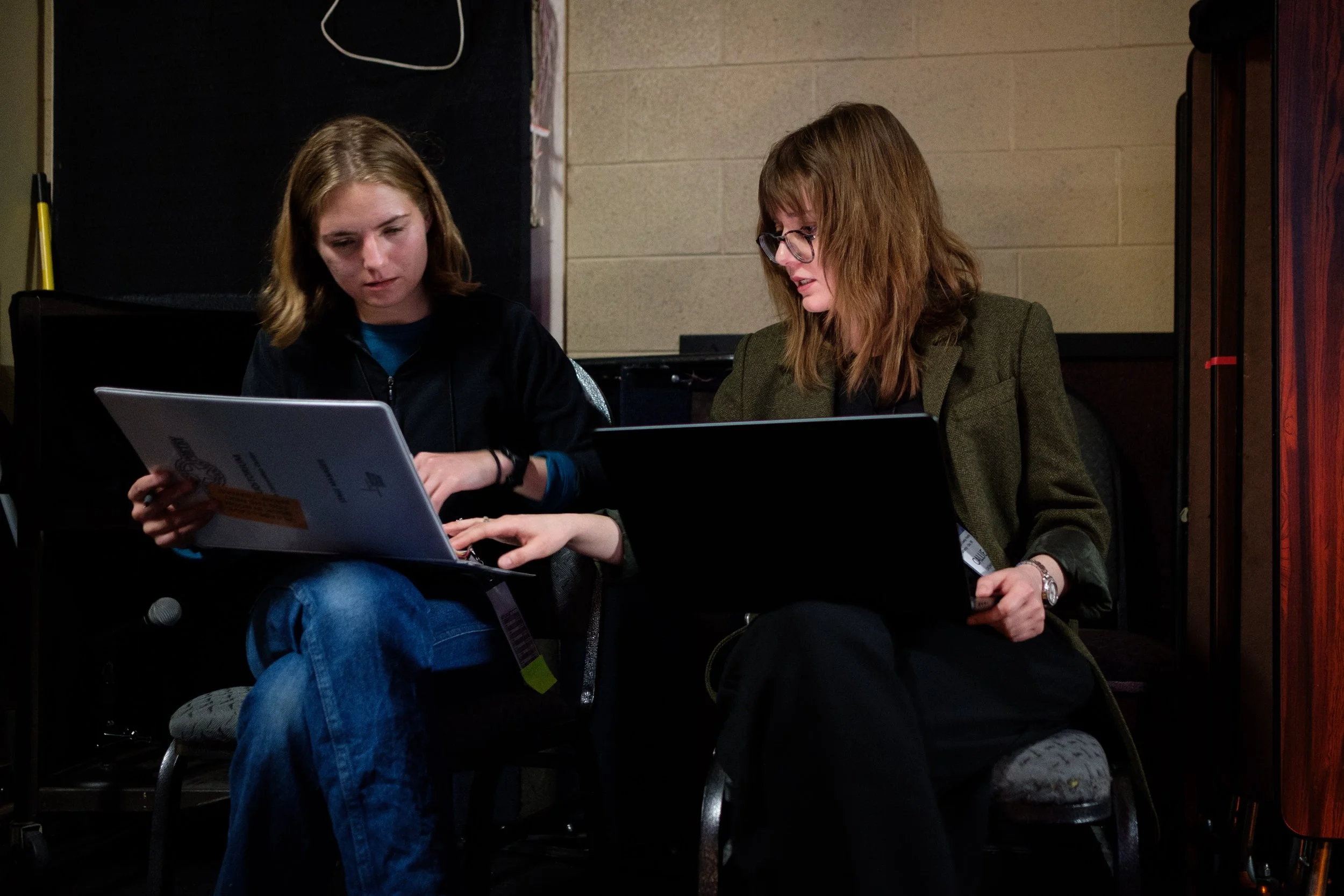 Callie and colleague Piper go over stage books 