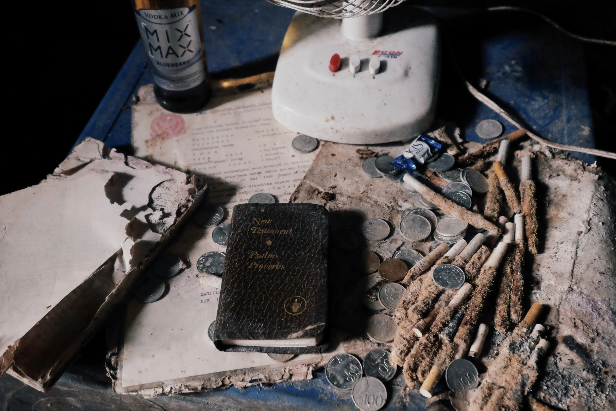 The half-smoked cigarettes of mourners are mixed in with the scant remnants of a dead man, now squirreled away in a cave in Ke’te