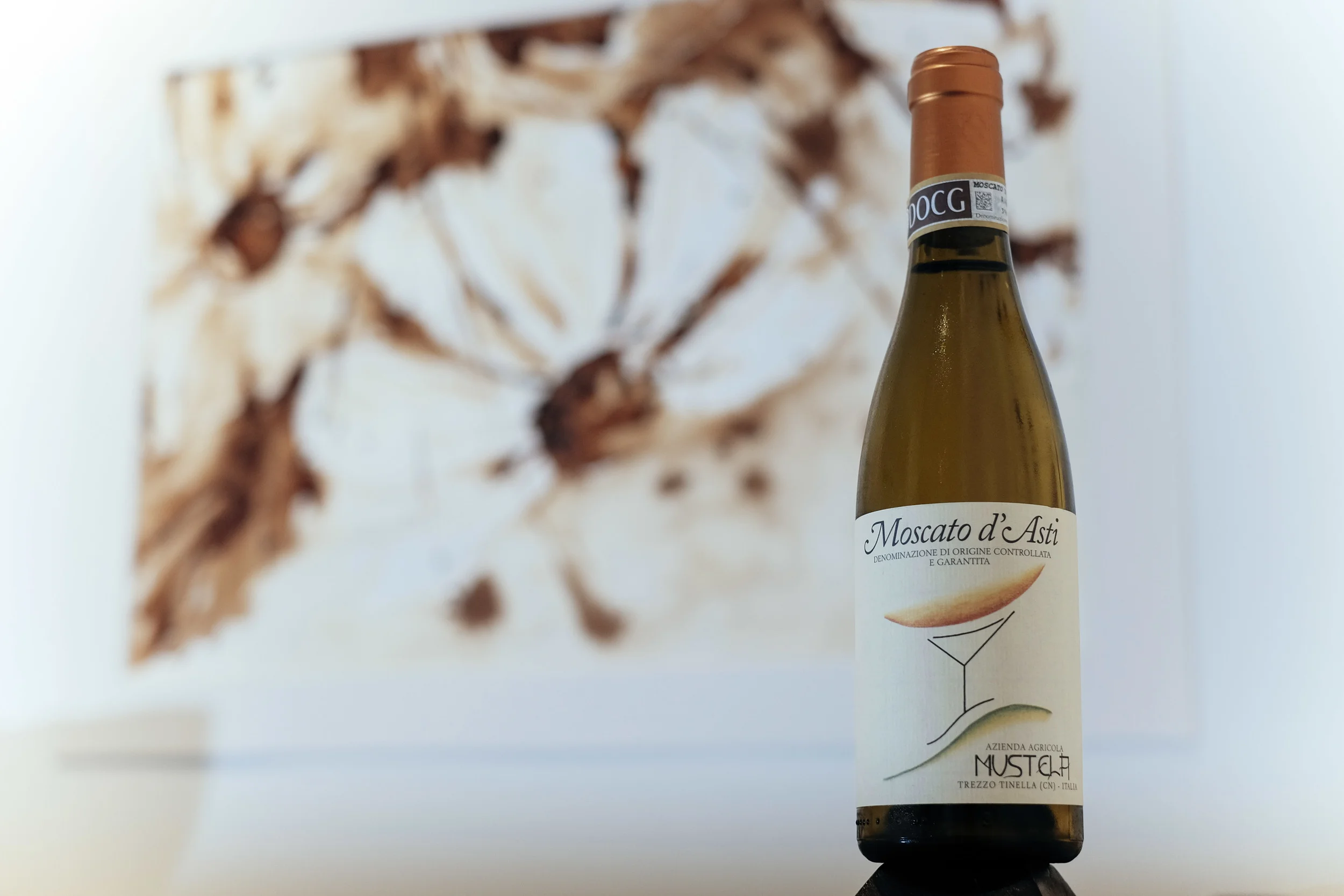 Foreground: Moscato d'Asti | Background: “Little Daisy Blooming", Maria Filatova-Chan