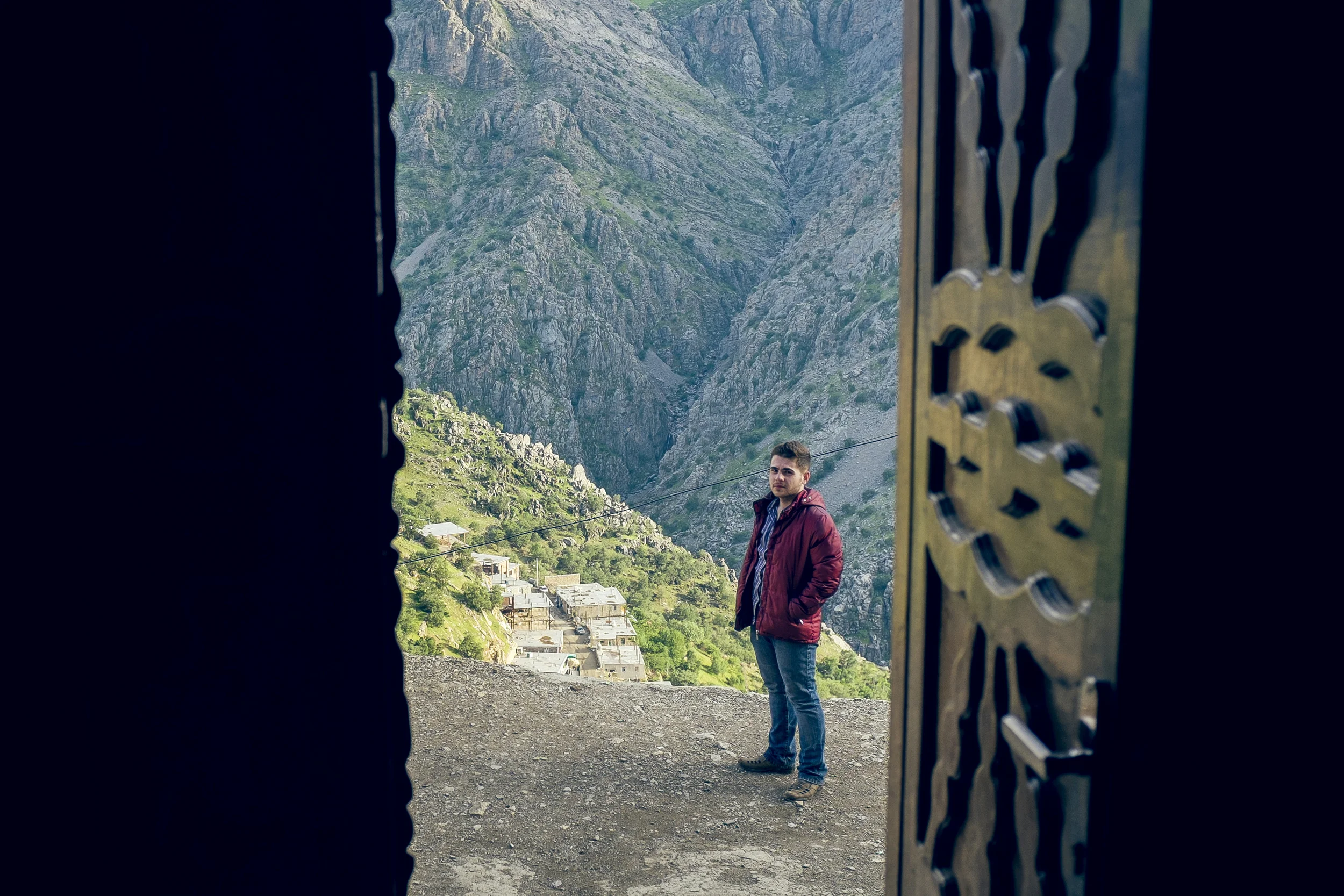Arshad, a dear friend who hosted and showed me around, with the cliffs of Hawraman Takht at the background.