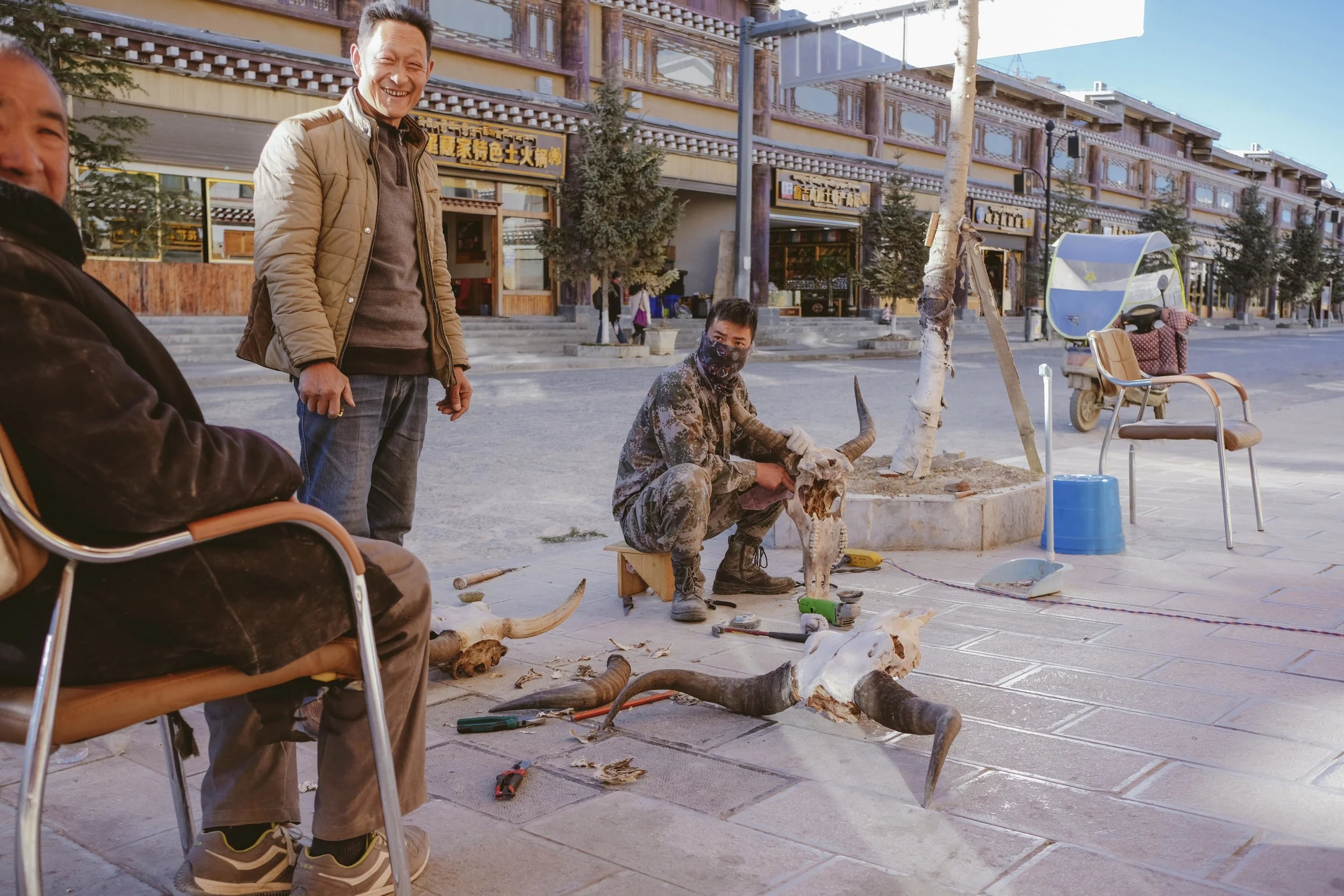 There's still a market for yak heads as ceremonial items, and what better place to polish them clean from gristle then out on the sidewalk. 