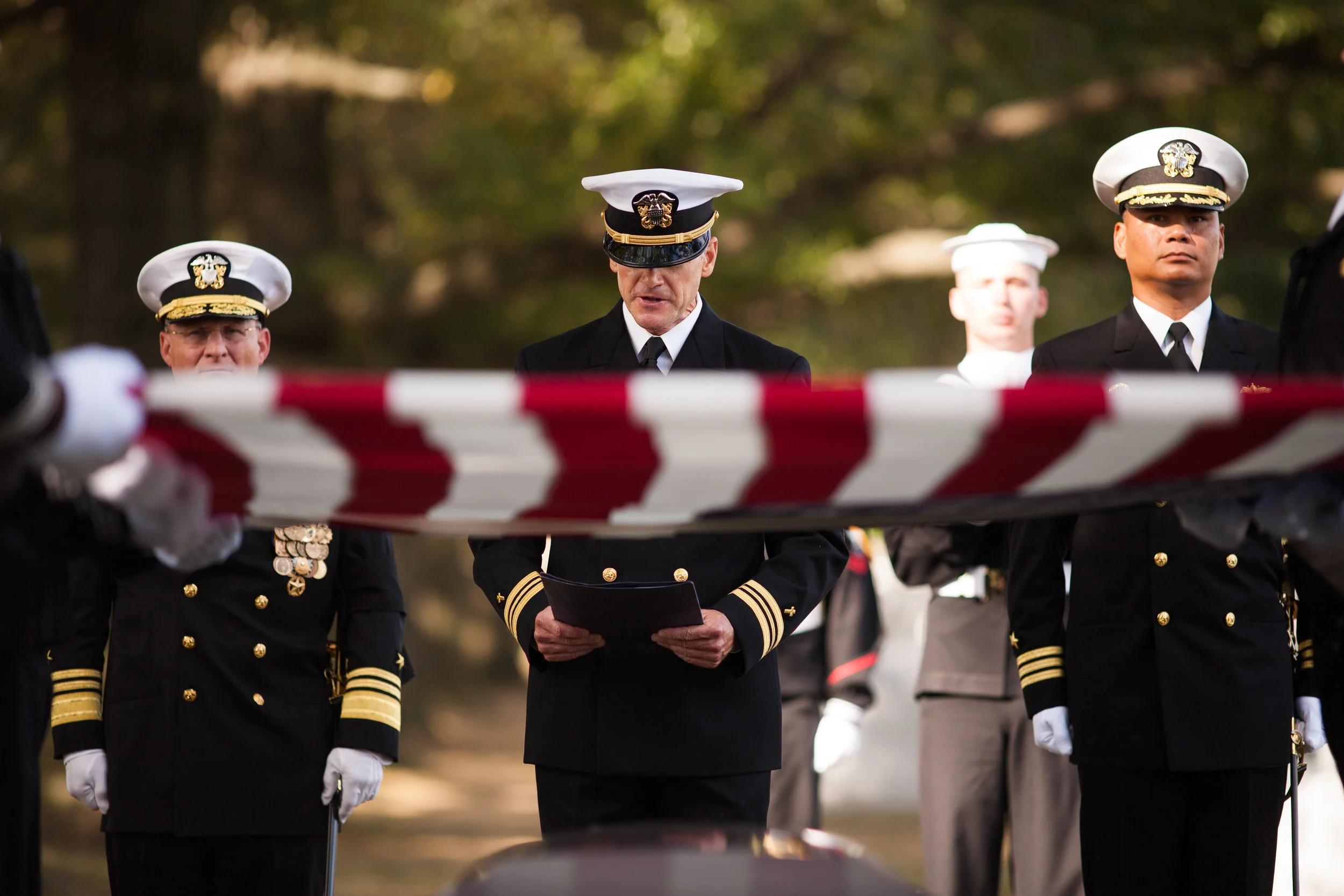 WASHINGTON D.C., October 05, 2017-- The Chaplain gives his service as the funeral commences. There is a strain in his voice as he pushes through to deliver, his words falling softly on those listening. Photo by Taylor Mickal