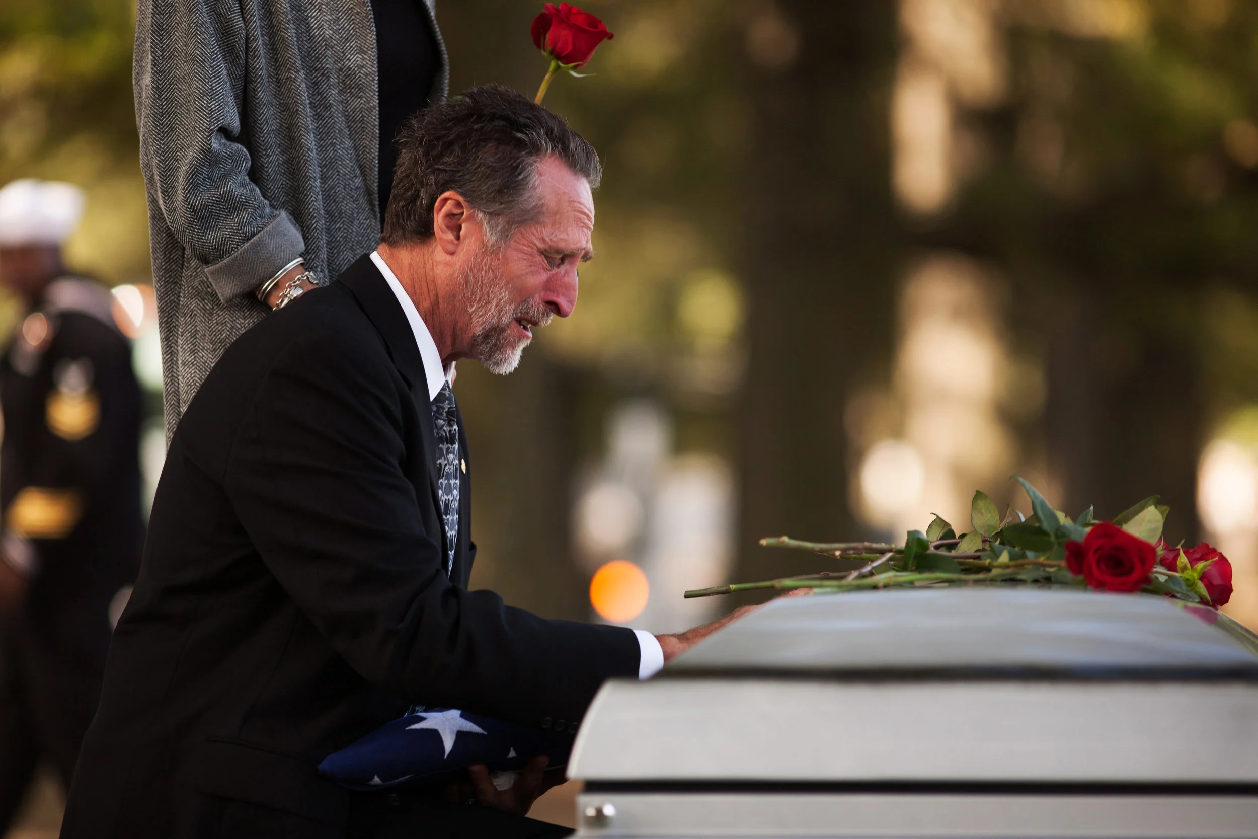 WASHINGTON D.C., October 05, 2017-- Kevin's father made several returns to the casket, unable to leave his son's side. On the third return, he fell to his knees and wept-- the agony of the loss to heavy to bear in the moment. Photo by Taylor Mickal