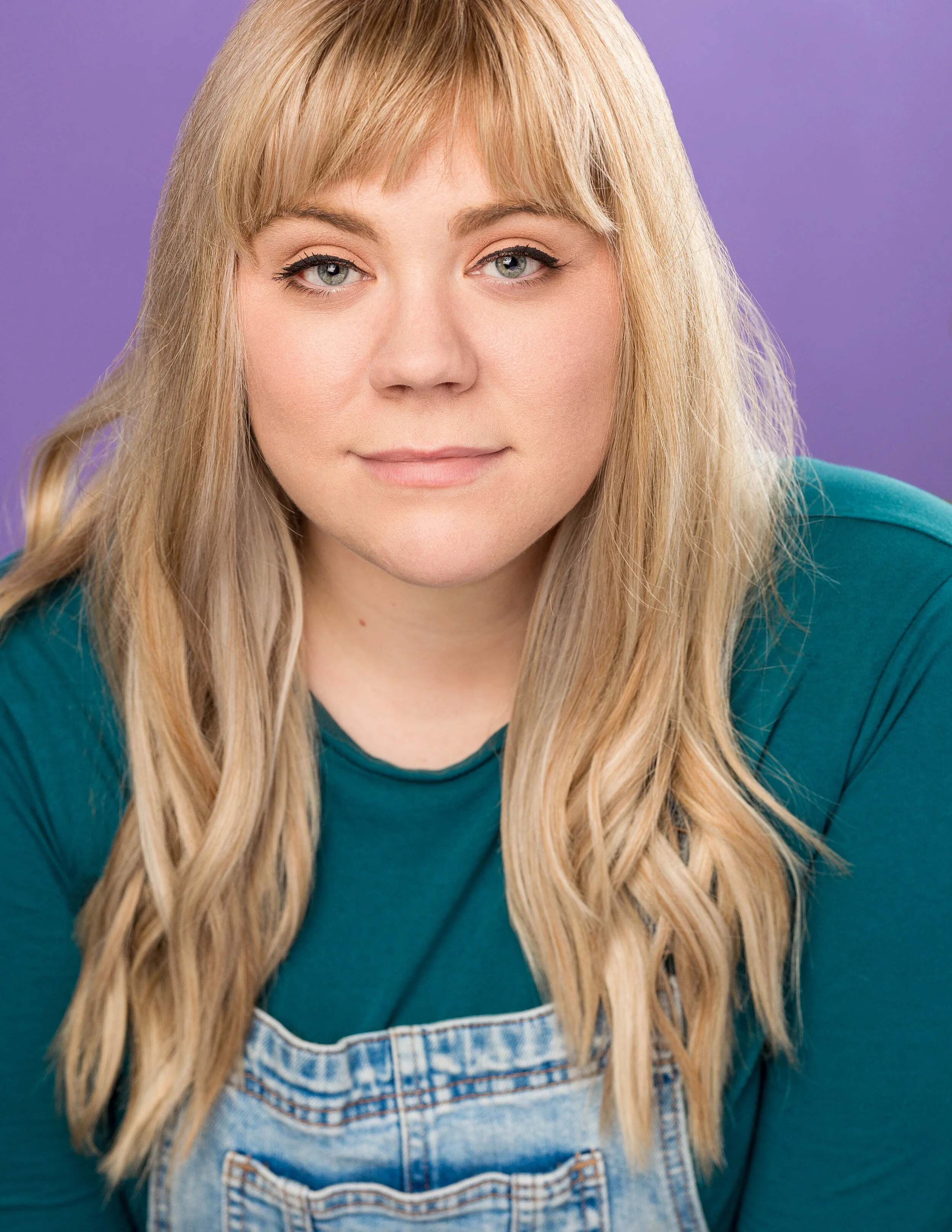 Meg_Headshot_Purple No Ring.jpg