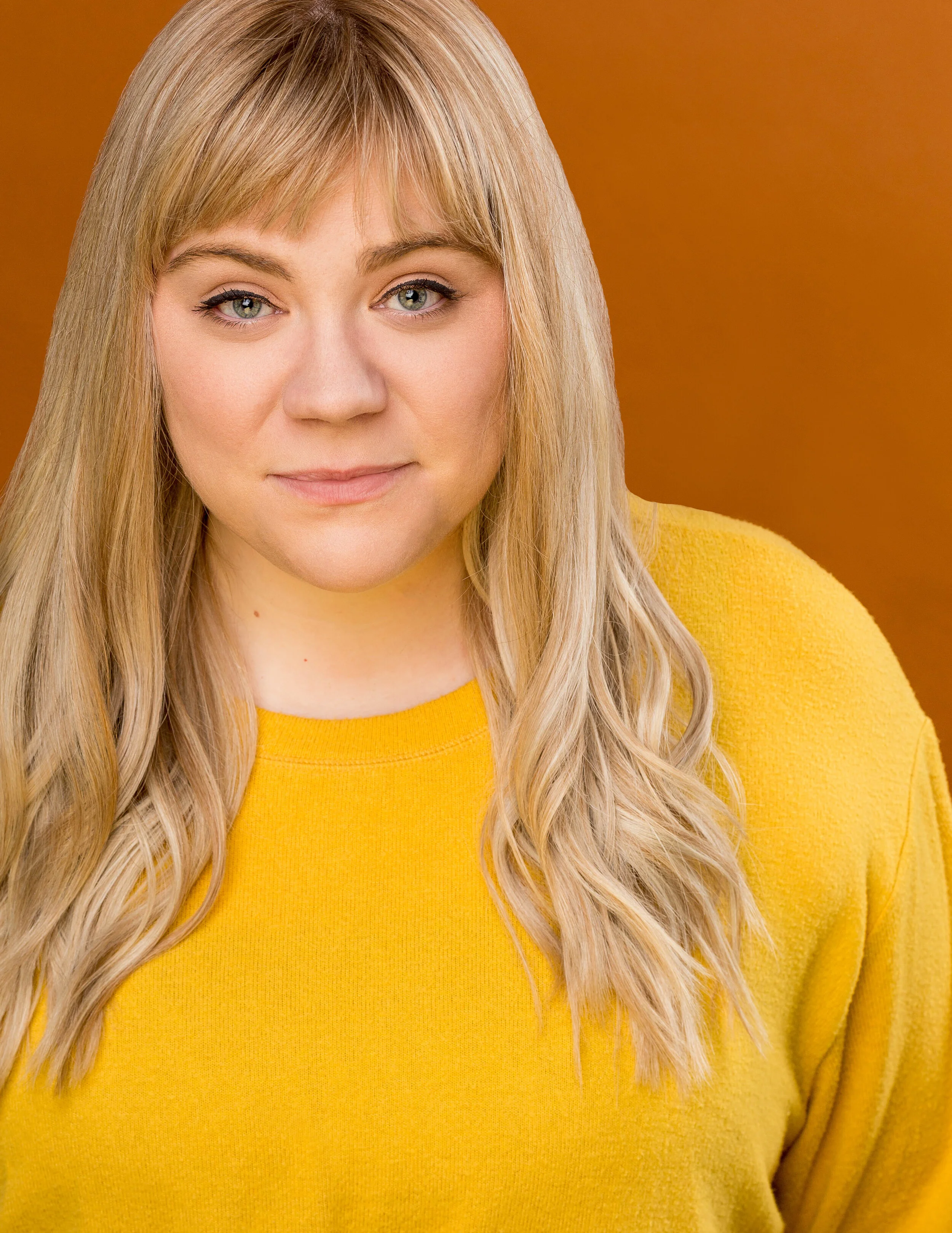 Meg_Headshot_Yellow No Ring.jpg