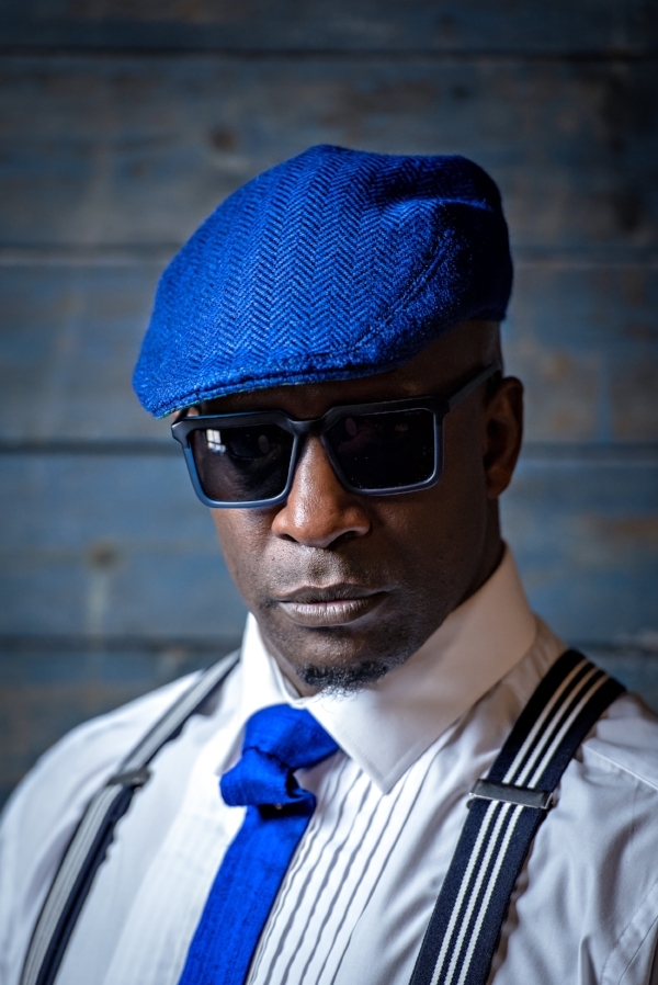 Choreographer & Dancer De-Napoli Clarke in our Peacock Blue cap