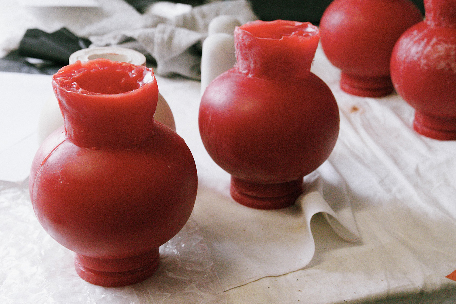Waxes ready to be transformed into Iris cast glass sconces.