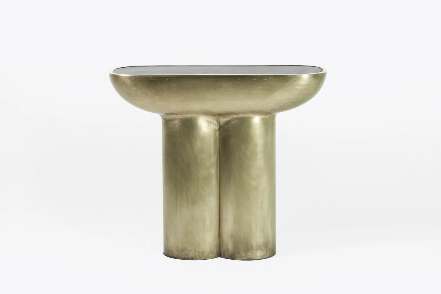 New console made with a single sheet of brass. Leather top.