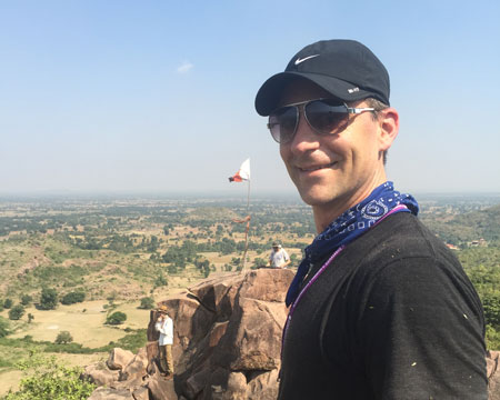 Luke in Khajuraho, India enjoying a birds-eye-view of the Himalayan Institute temple and shrine.