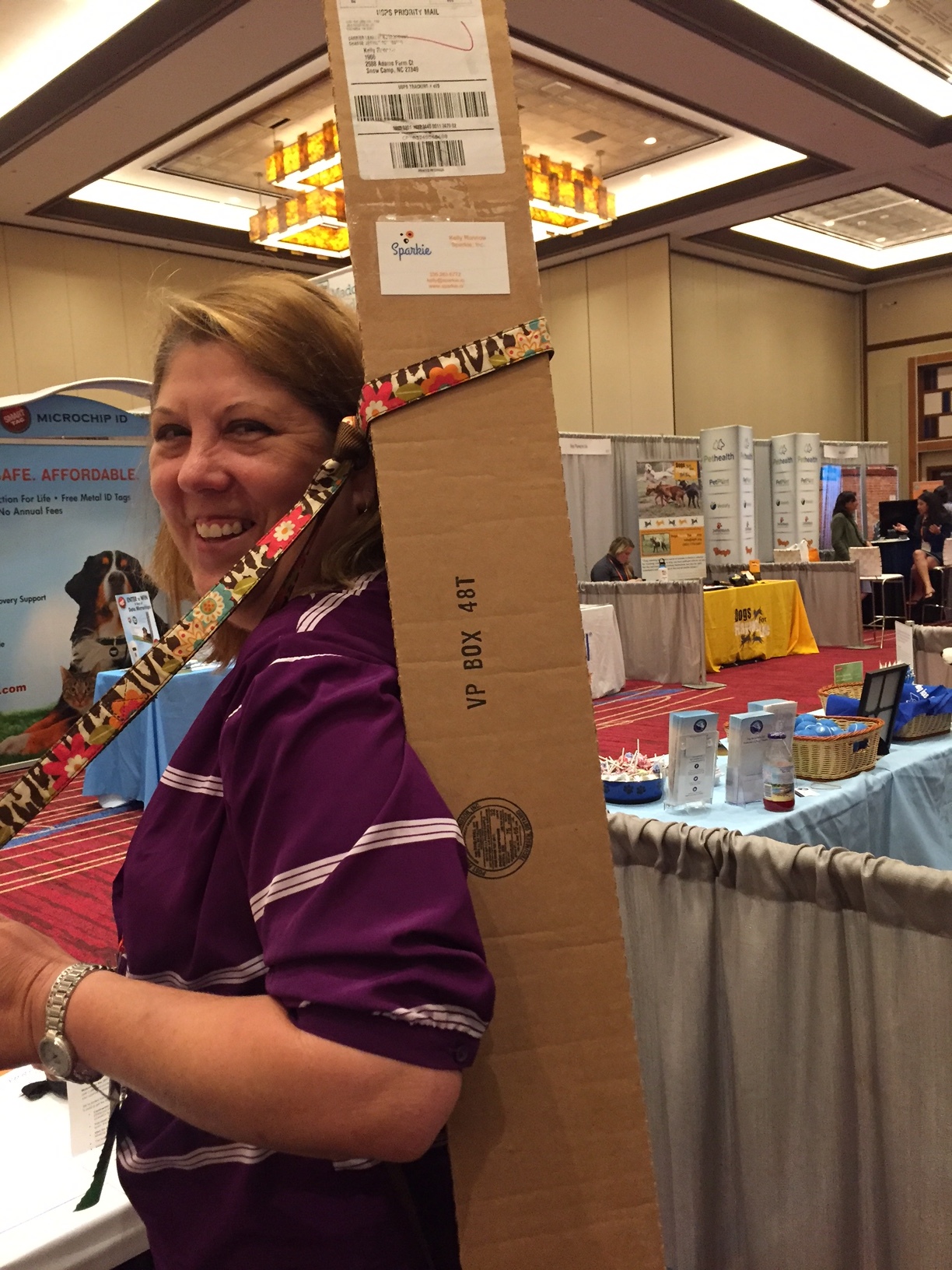 E ver a budgeter, Kelly literally put the strap (or leash?) in bootstrapping by using a dog leash to help carry our oblong banner on the flight up to the conference!
