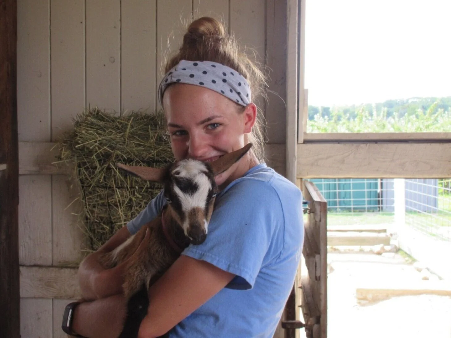 Counselor holding a goat