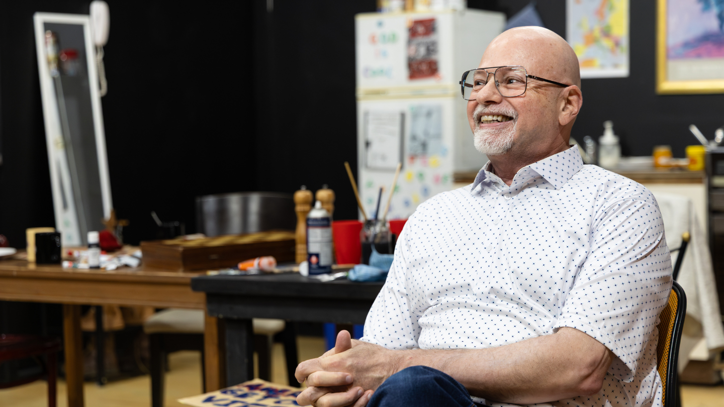 Howard Fine observing actors during a Masterclass session at Howard Fine Acting Studio Australia, smiling during scene feedback and direction.