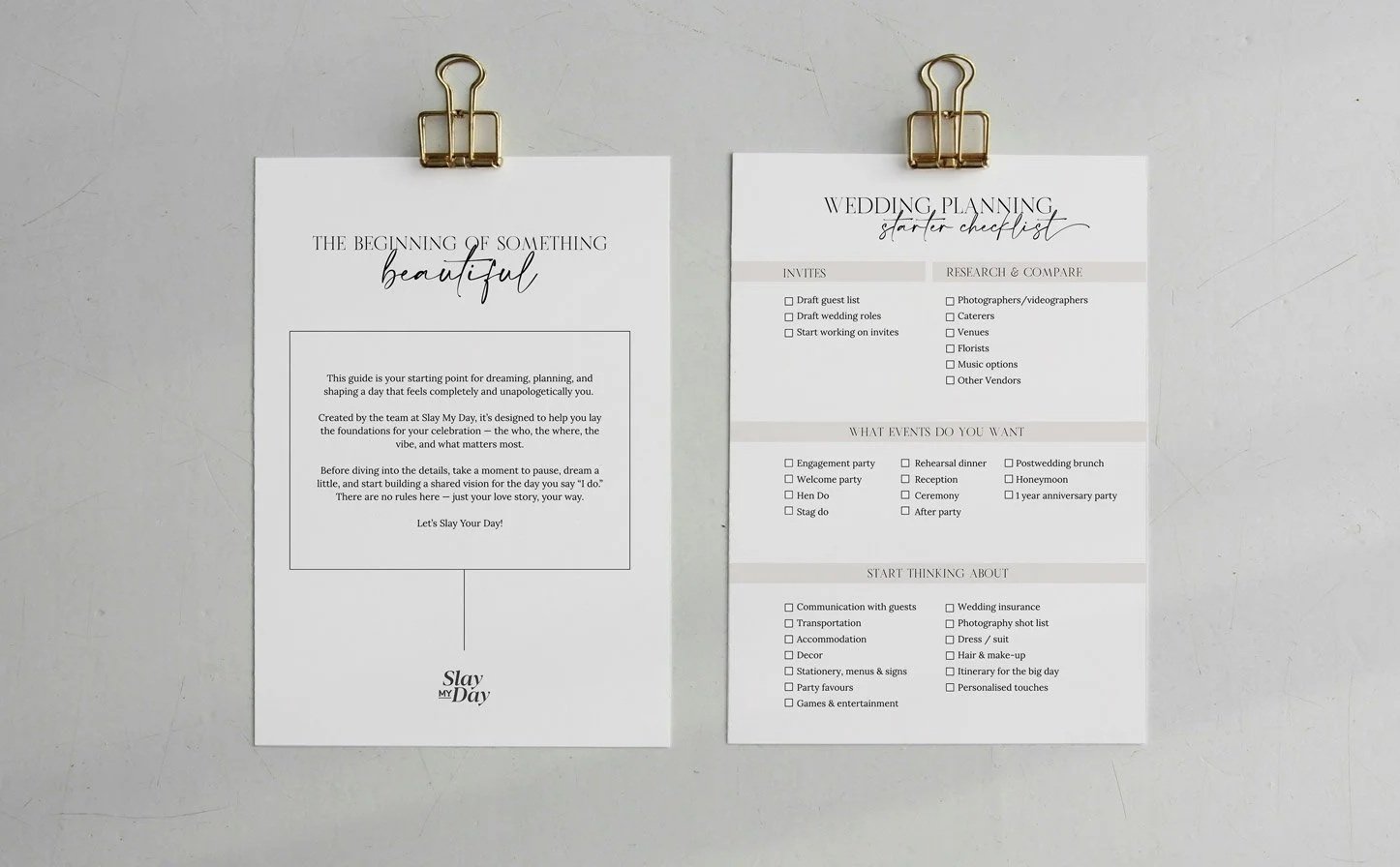 Two white sheets of paper clipped with gold clips, with wedding planning checklists and informational text.