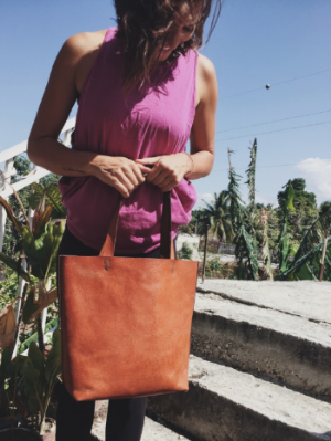 Classic leather tote in tan. It's crisp. It's timeless. It's leather. Enough said.
