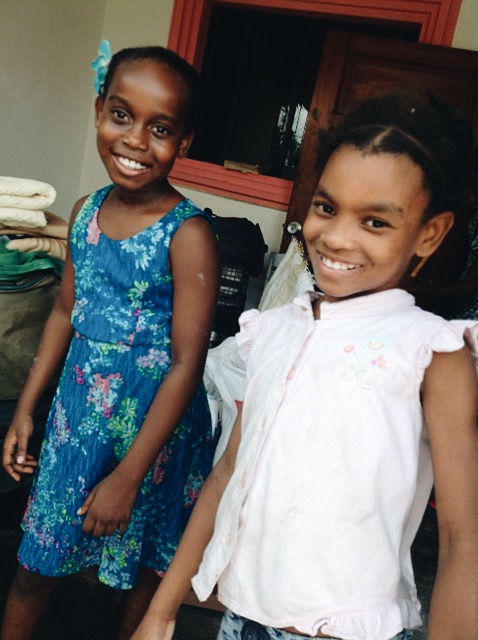 Little girls from the church helping the team load everything up 