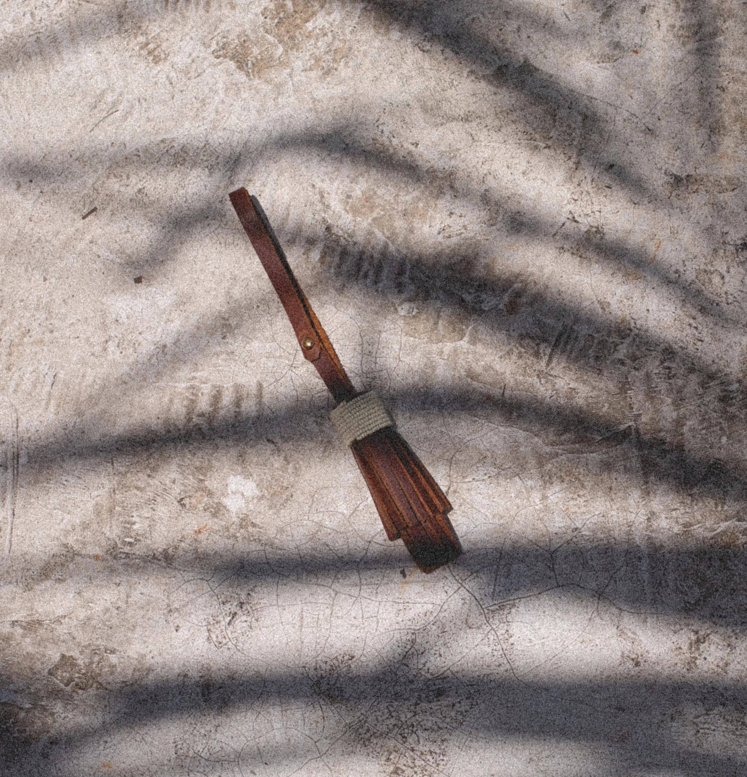 Beaded Leather Tassel Chestnut Flat Lay Shadow.jpg