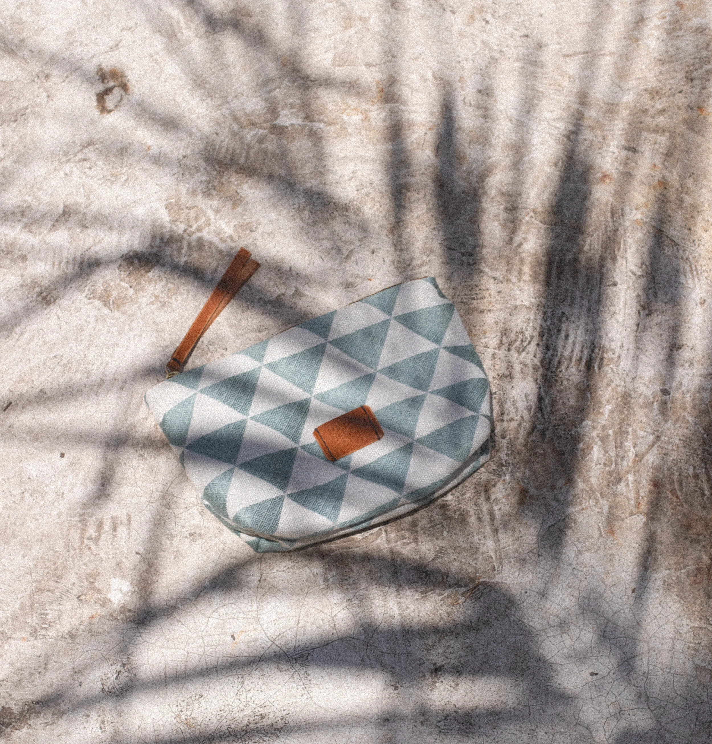 Toiletry Case Triangle Flat Lay Shadow.jpg