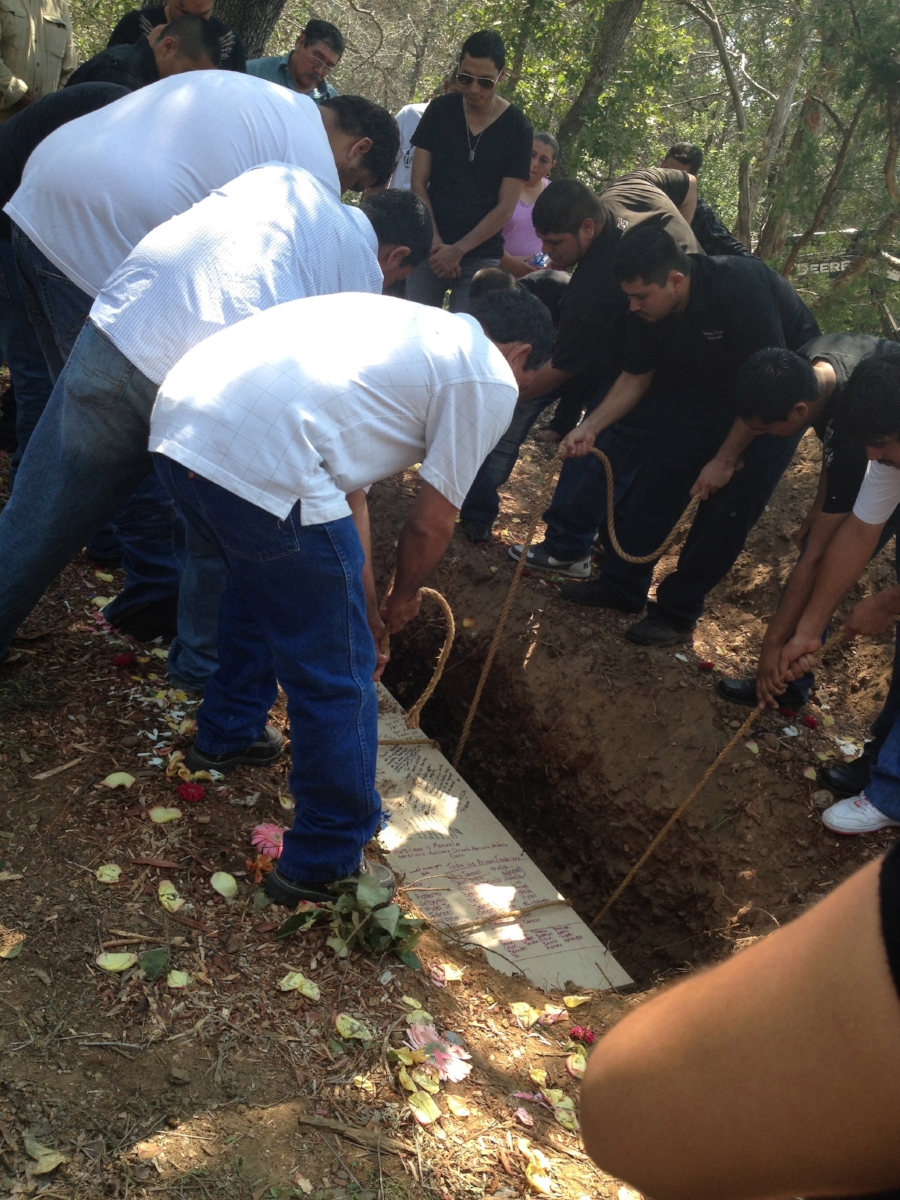 A family participating in a green burial, photo courtesy of Sarah Wambold.
