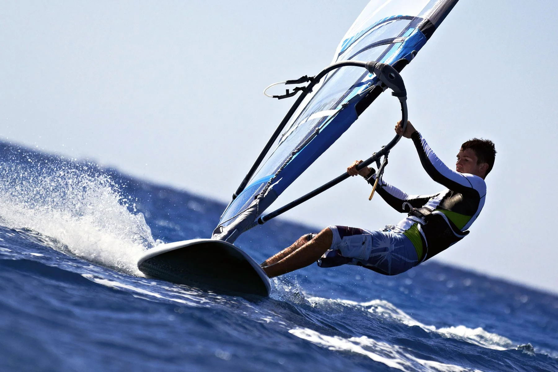bigstock-Side-View-Of-Young-Windsurfer-31219556-copy.jpg
