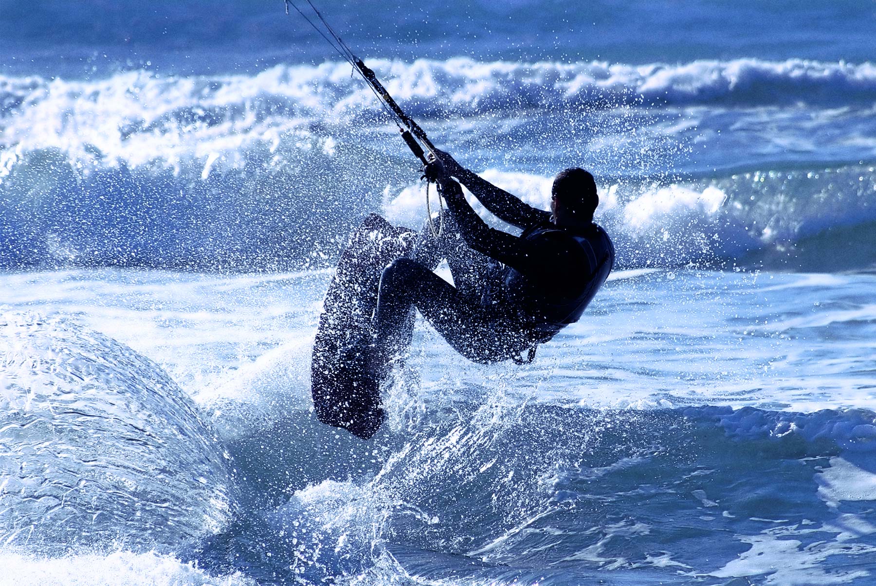 bigstock-Unidentified-kitesurfer-jumps--18389087-copy.jpg