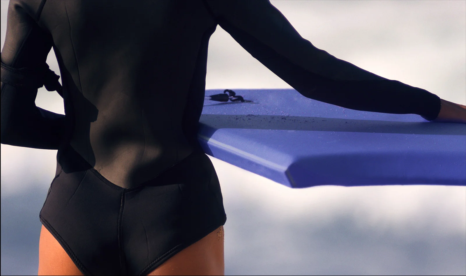 bigstock-Female-Surfer-Stands-Beach-Wat-112157789-copy.jpg
