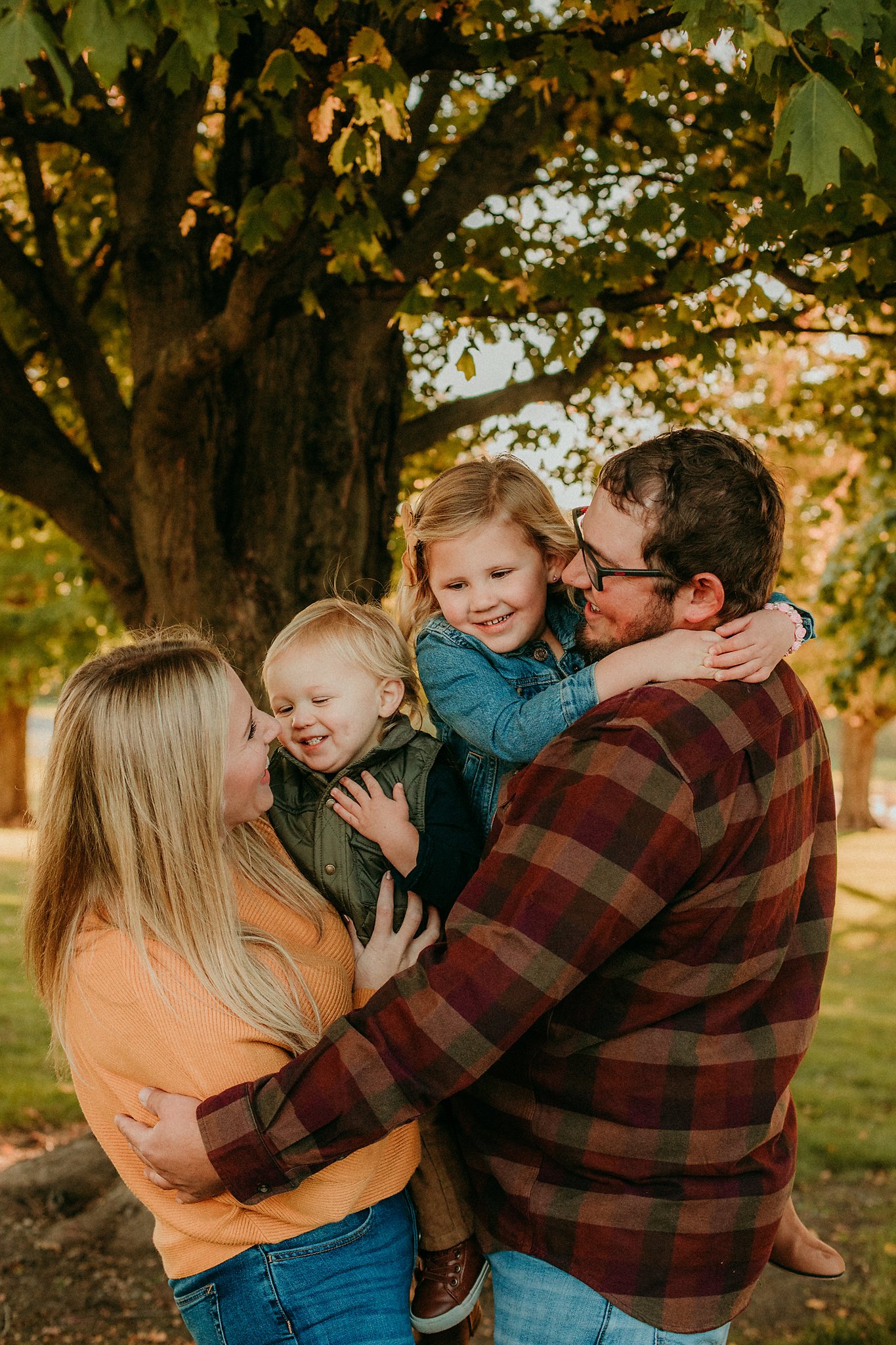 parents_squish_laughing_kids_together.jpg