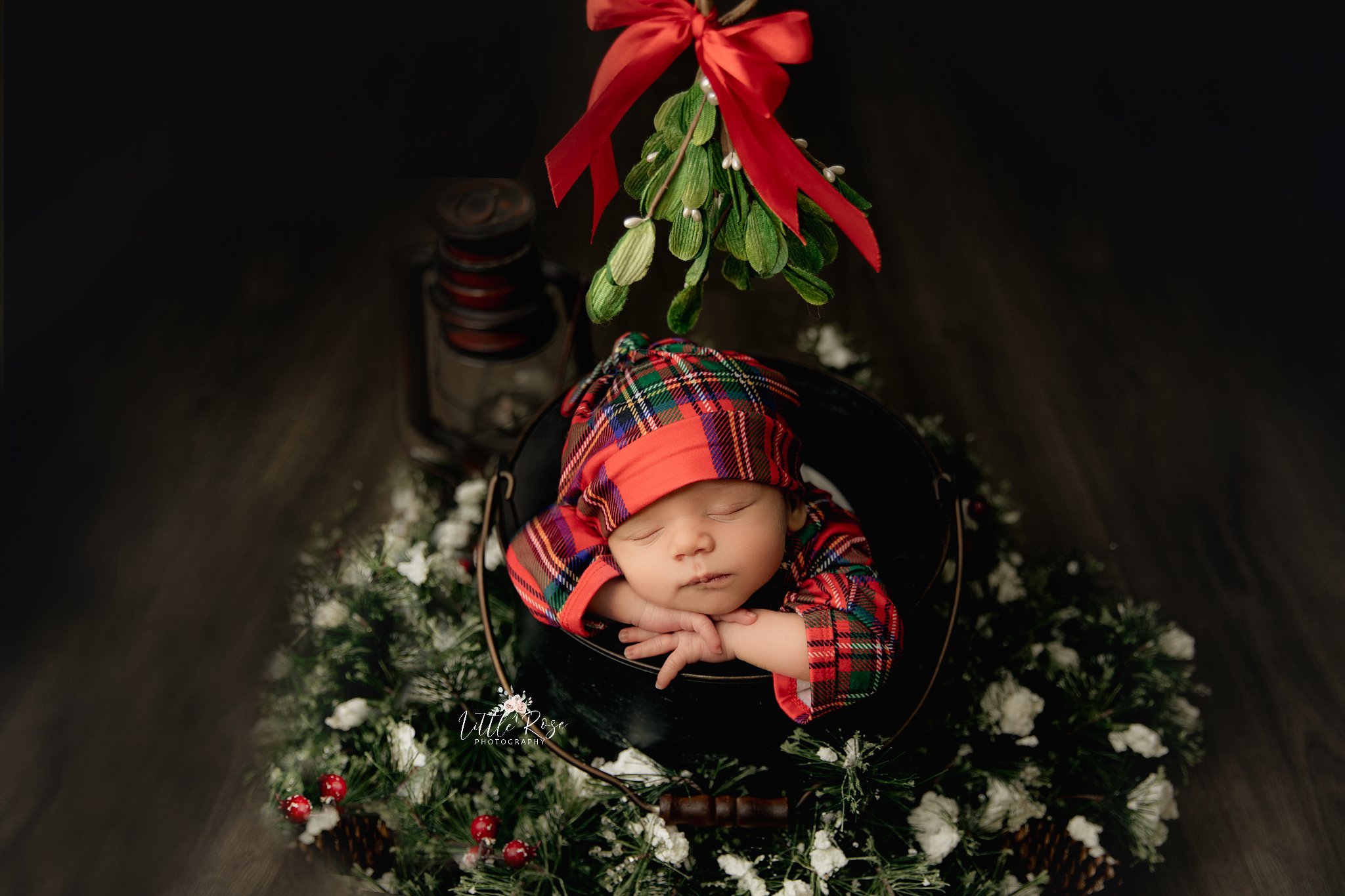 newborn_sleeps_on_christmas_photo_setup.jpg.jpg